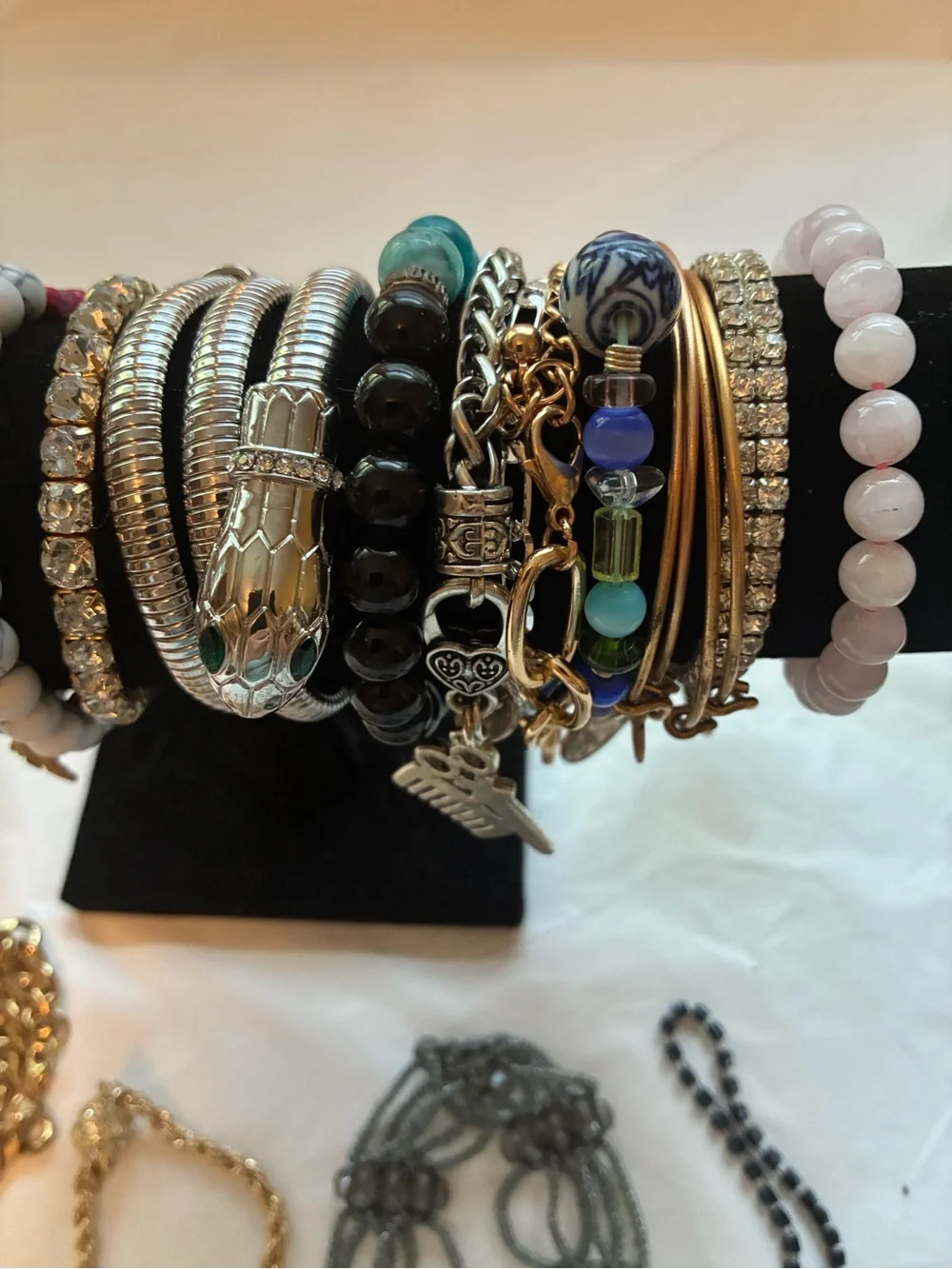 33 Vintage and modern bracelets. Some are stretchy and some aren’t.